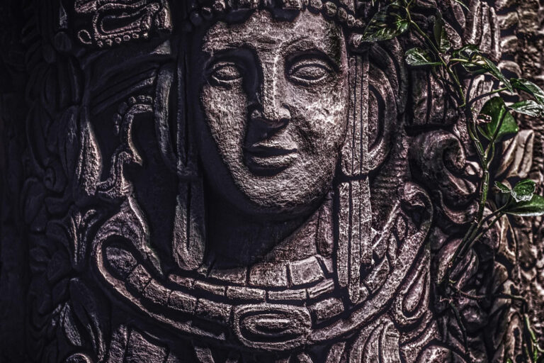 beautiful rocky monument with carved image human face jungle close up view