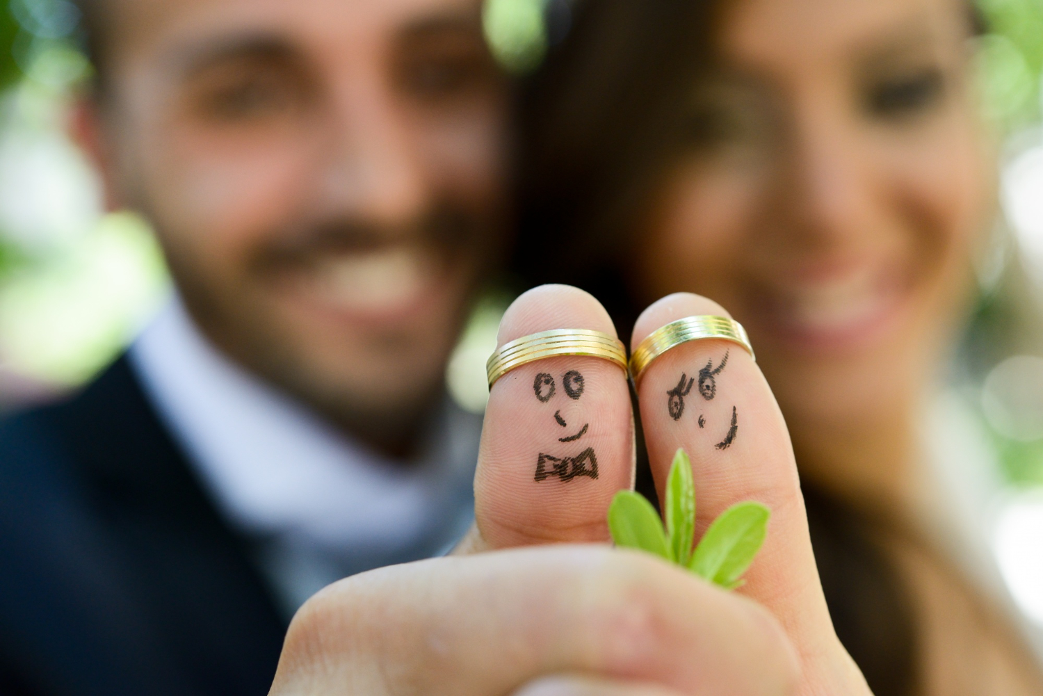 close up newlyweds painted fingers